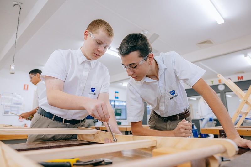 Year 8 students working together in woodworking class