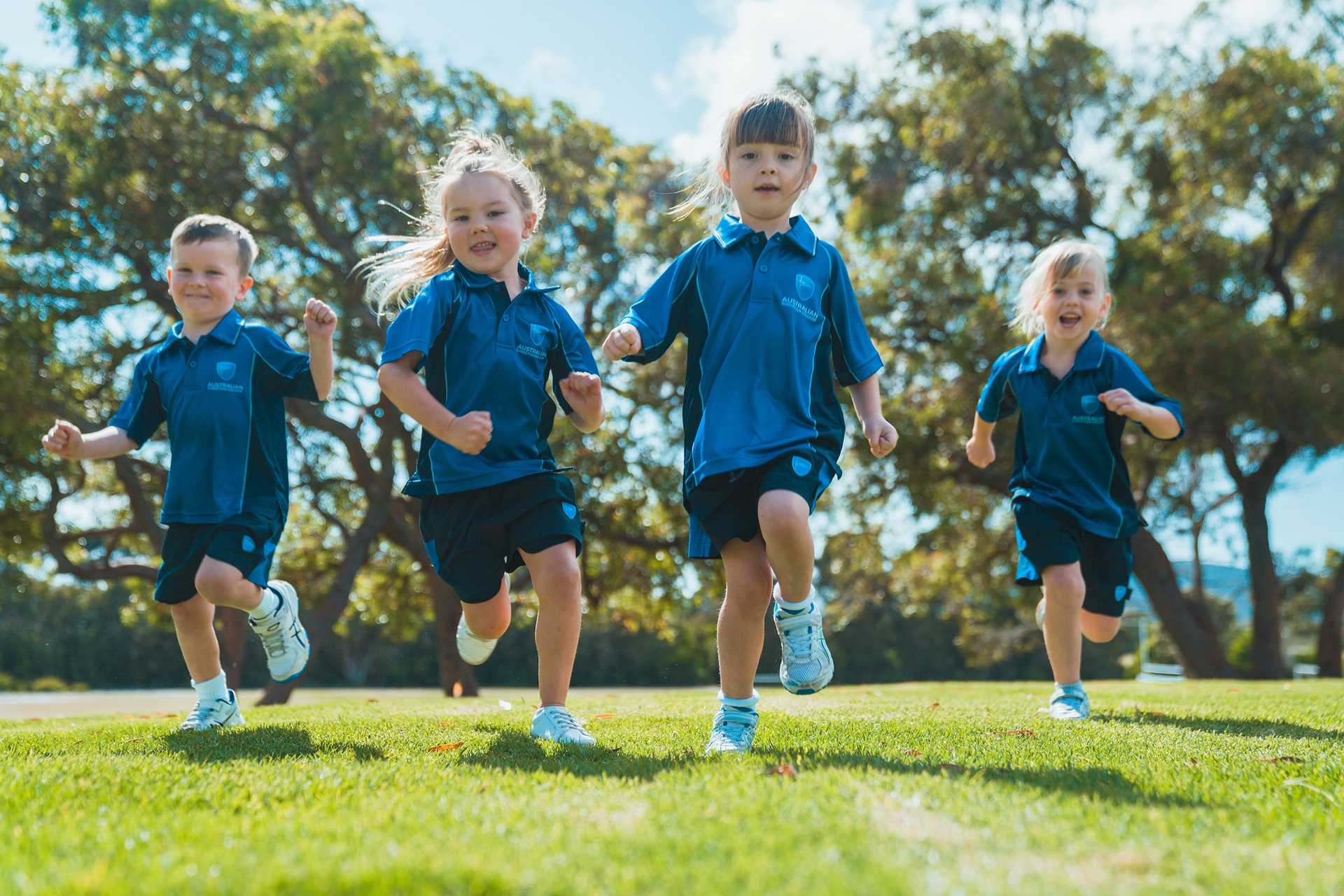 ACC Southlands Kindergarten students in sports uniform running towards camera