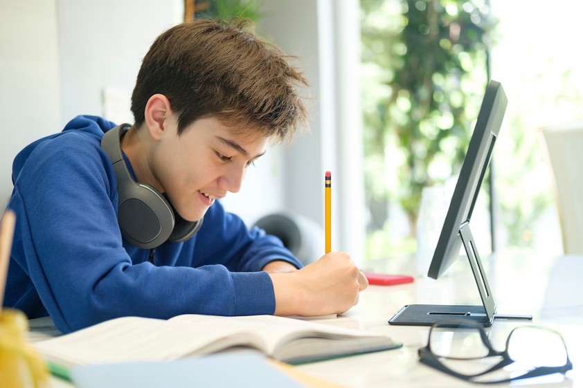 Secondary-boy-student engaged-in-online-learning