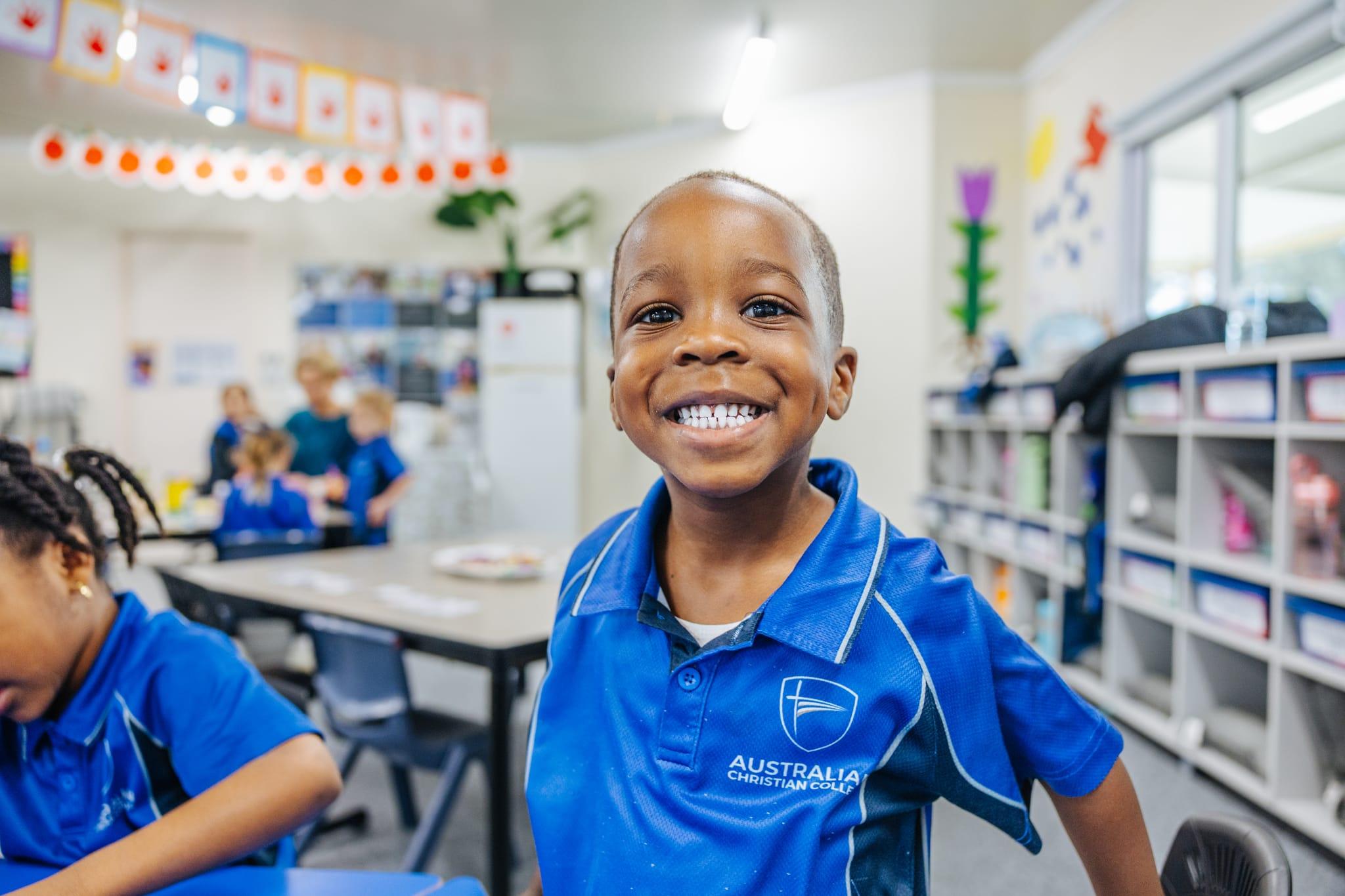Smiling secondary student on a campus pathway during a school tour at ACC Darling Downs