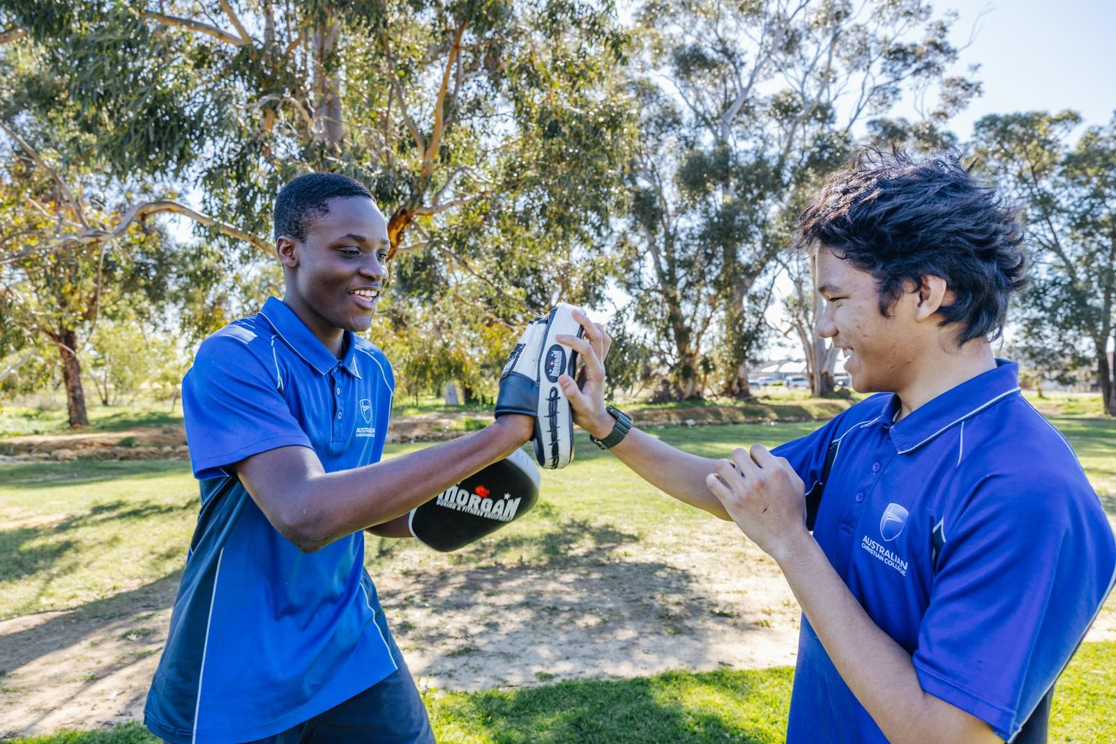 Students training together outdoors, staying active and healthy through sport at Darling Downs WA.