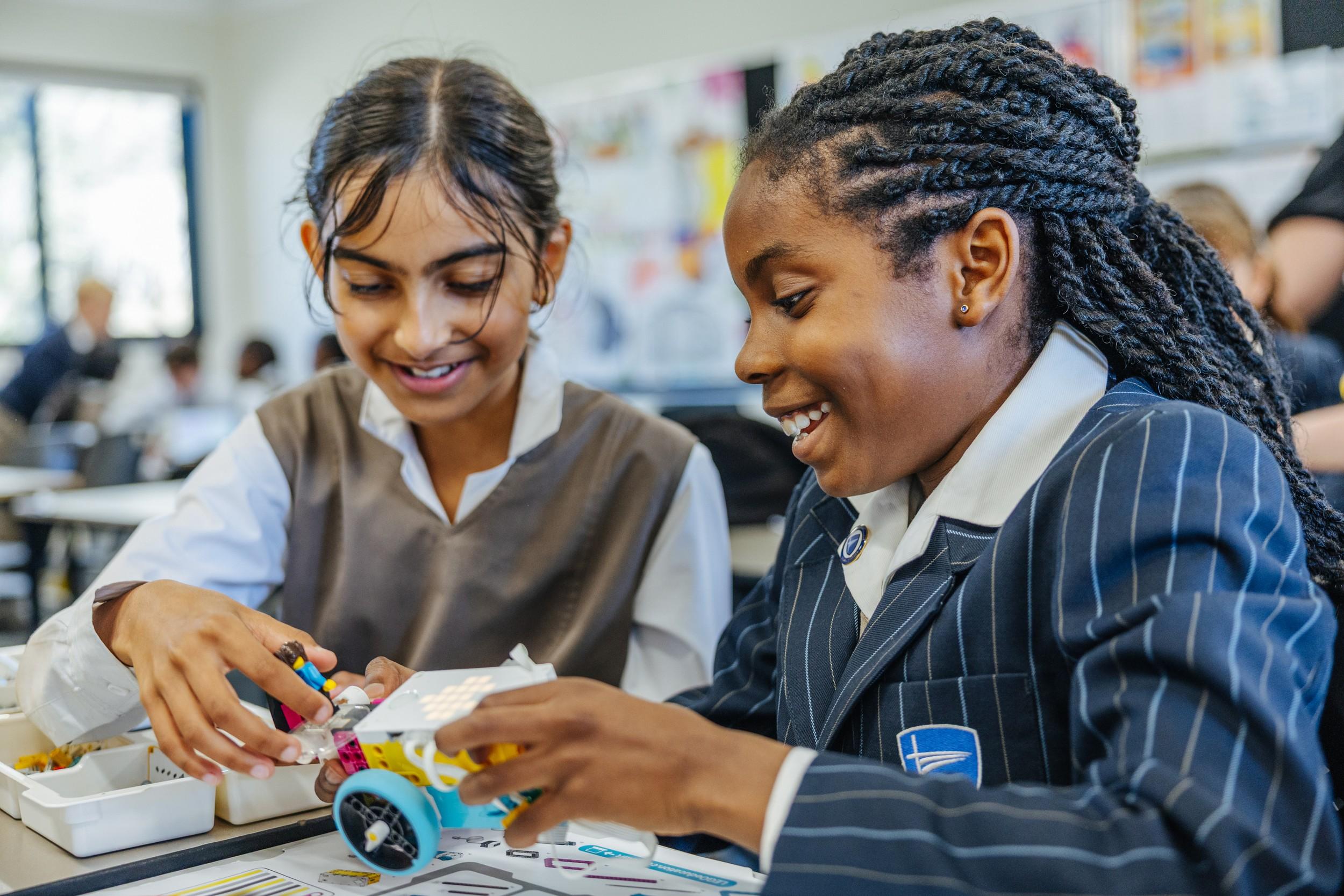 Secondary students building a robotics kit during a STEM activity at ACC Darling Downs co-curricular program.