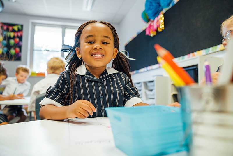 Year 1 student smiling at camera