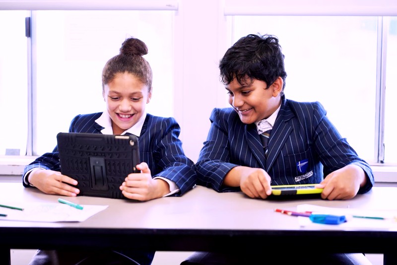 ACC Darling Downs students sitting at desk using tablet