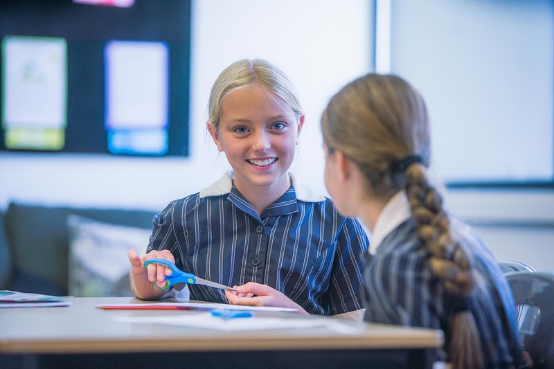 ACC Darling Downs high school girl smiling holding scissors