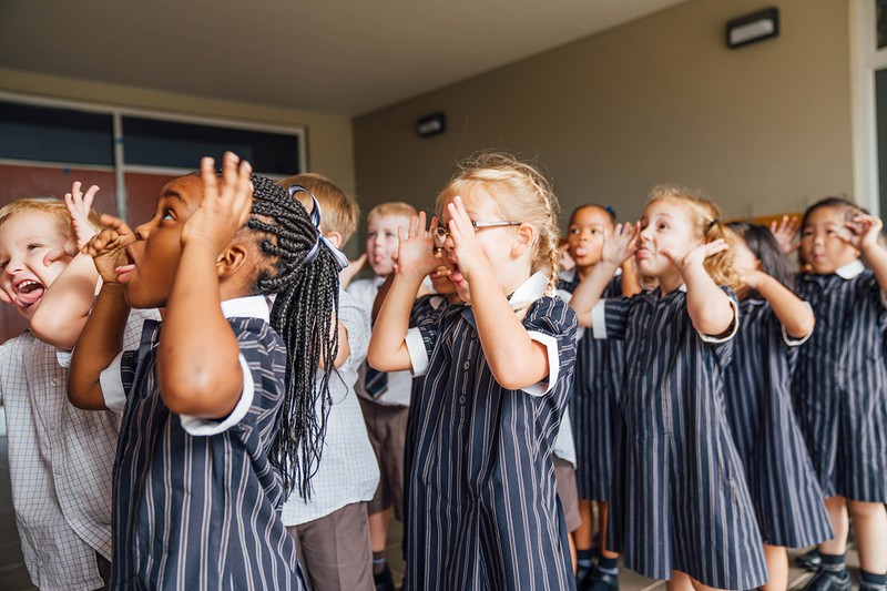 Uniformed students at ACC Darling Downs lined up making faces