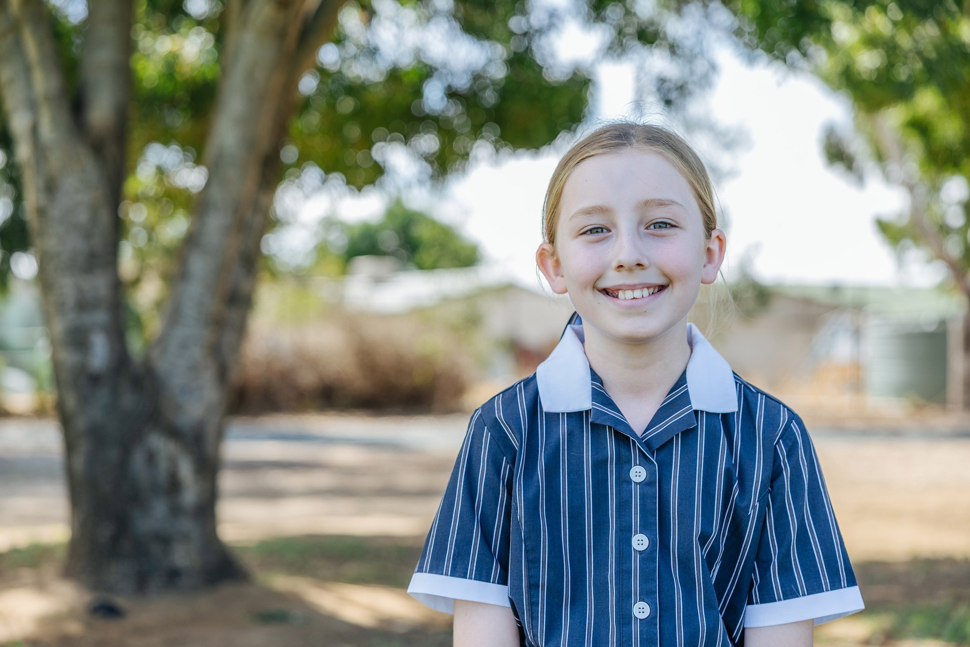 Smiling Echuca year 7 student wearing ACC Echuca school uniform blazer