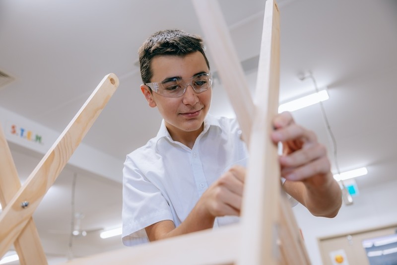 Echuca High School boy woodworking wearing safety glasses