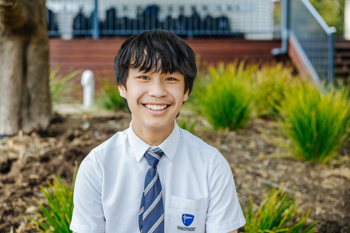 Smiling secondary student at ACC Hobart — tap to learn about enrolments