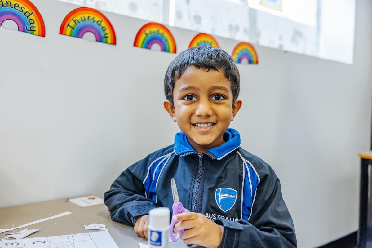 Primary student working at a desk at ACC Hobart — tap to learn about our primary programme