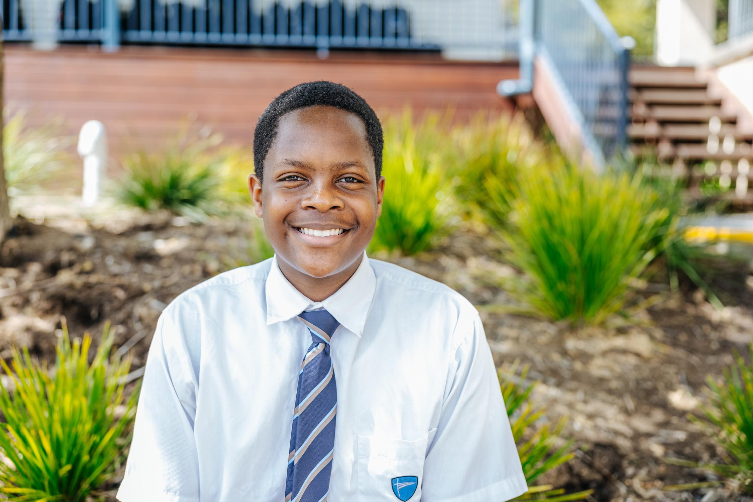 Smiling secondary student in school uniform on the ACC Hobart campus
