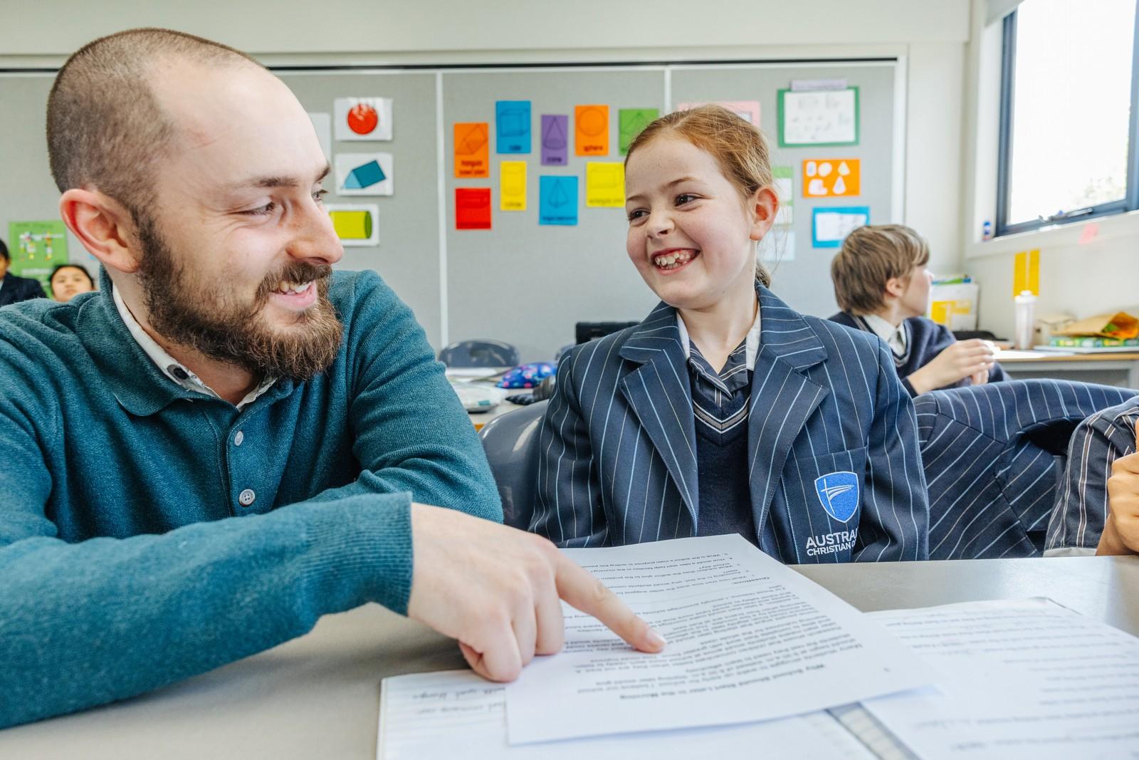 A teacher working one-on-one with a Primary student in a Geilston Bay classroom.