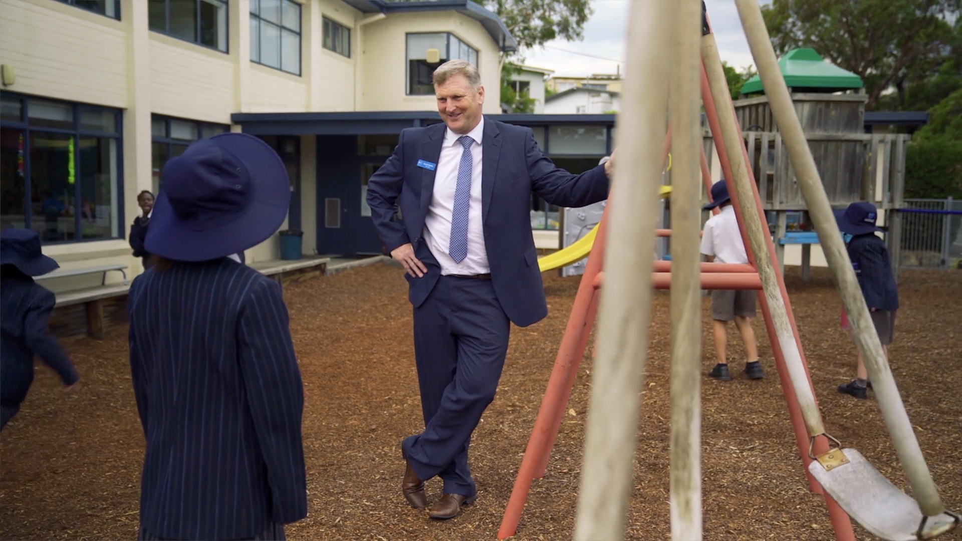 ACC Hobart principal David Noble interacting with students in the school playground