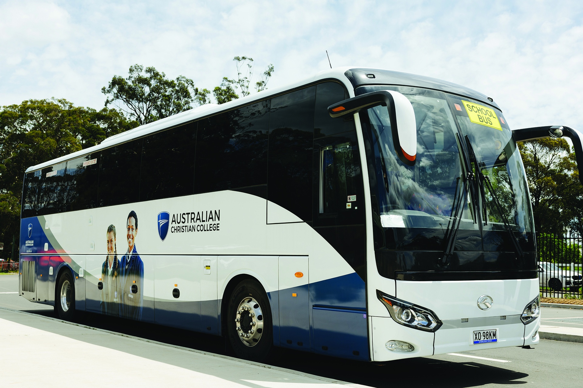 ACC Hobart private bus with decal of students on the side