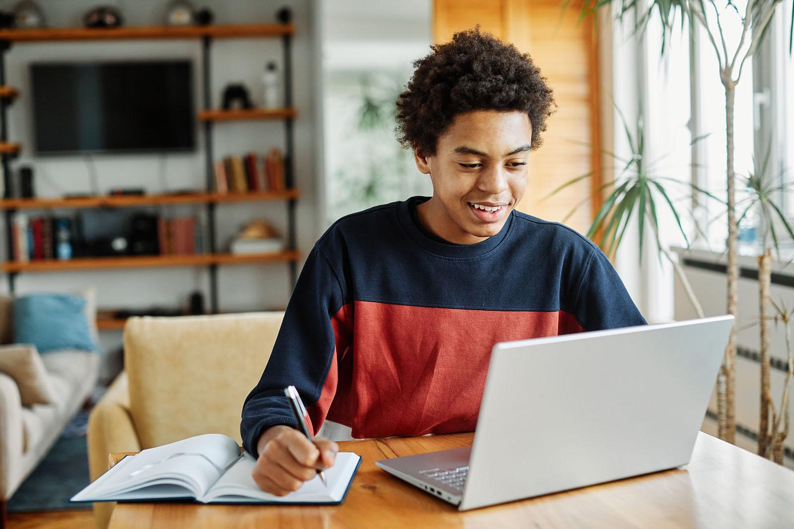 Student studying at home on a laptop for ACC Launceston Distance Education