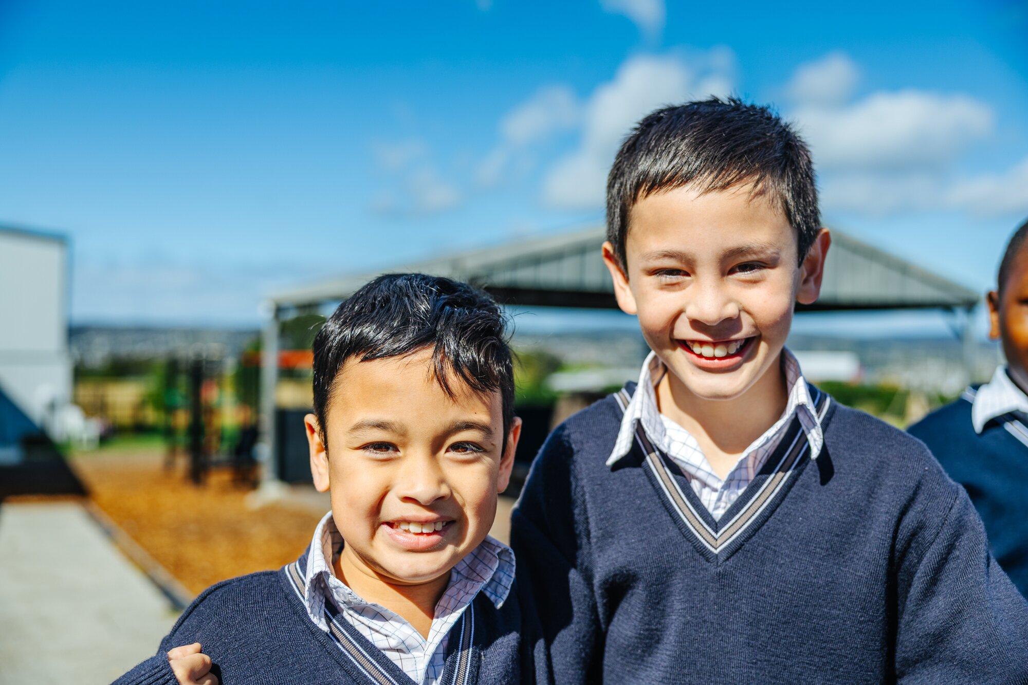 Two primary boys in ACC formal uniform outdoors at Launceston
