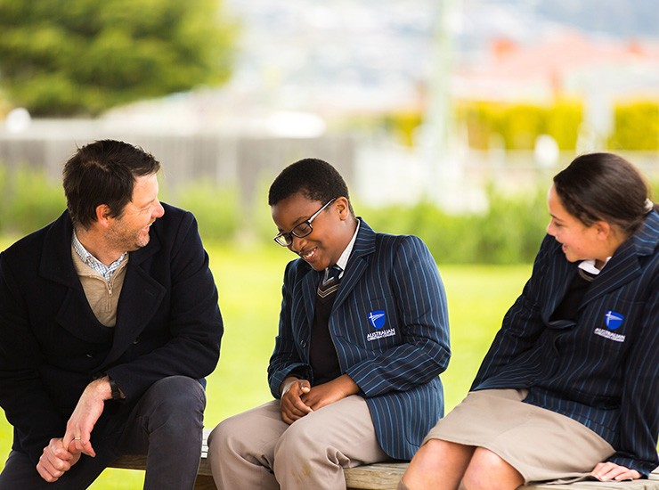 Principal laughing with students