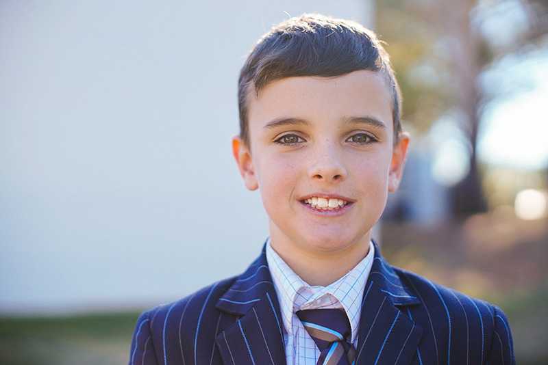 ACC Launceston primary student in blazer and tie
