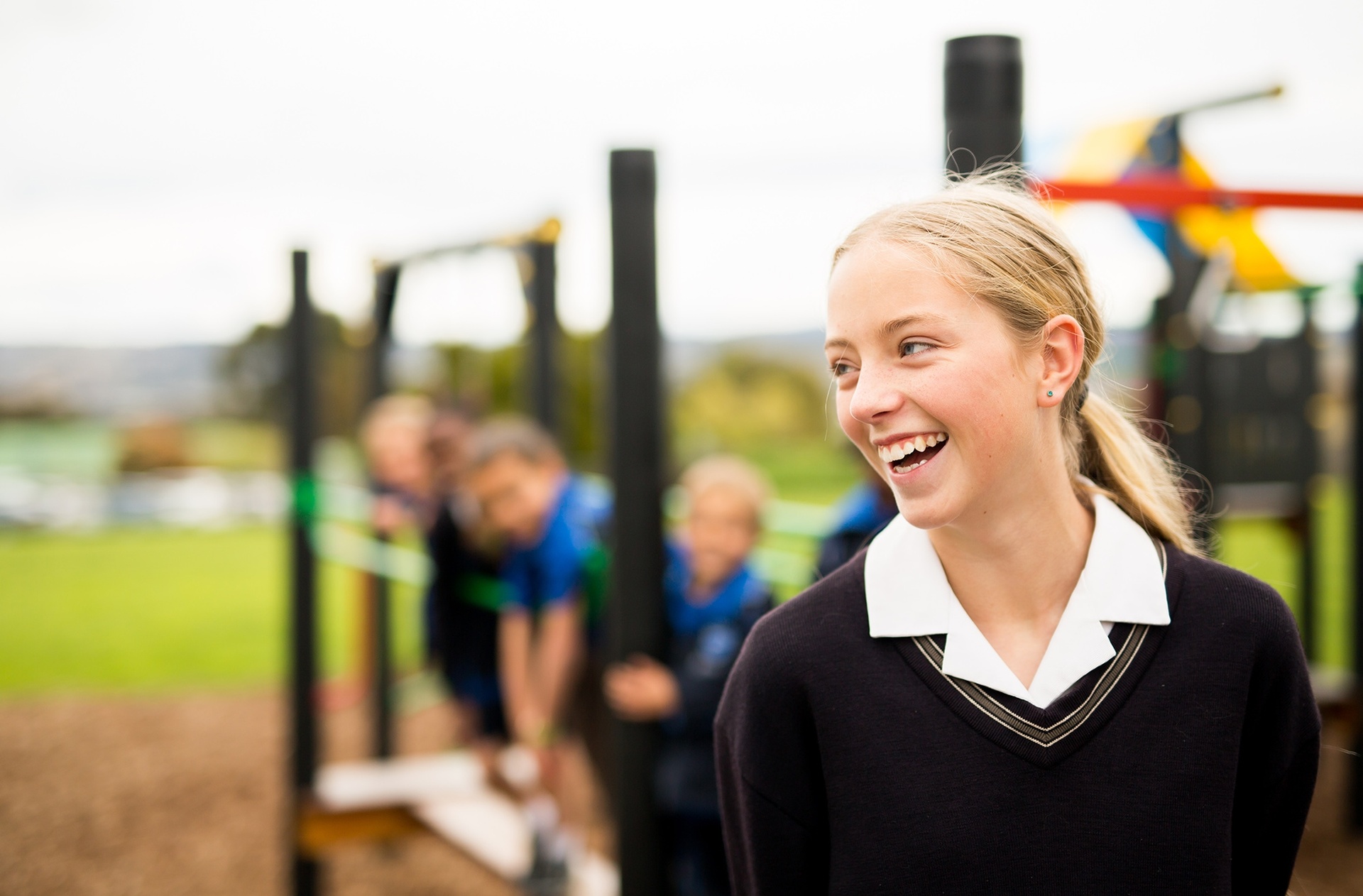 Smiling ACC Launceston student in uniform wearing a jumper