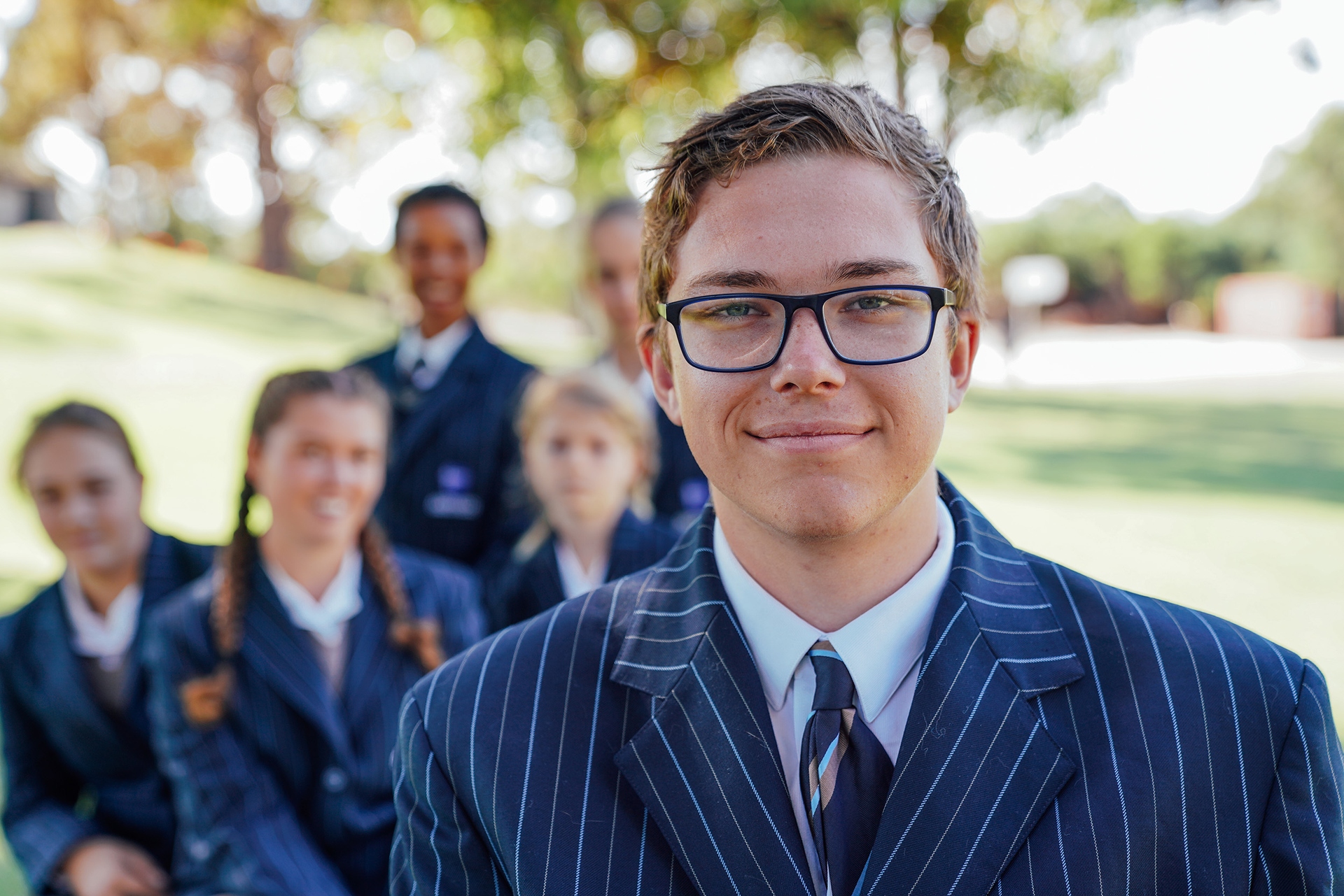 ACC Launceston secondary student wearing glasses and blazer