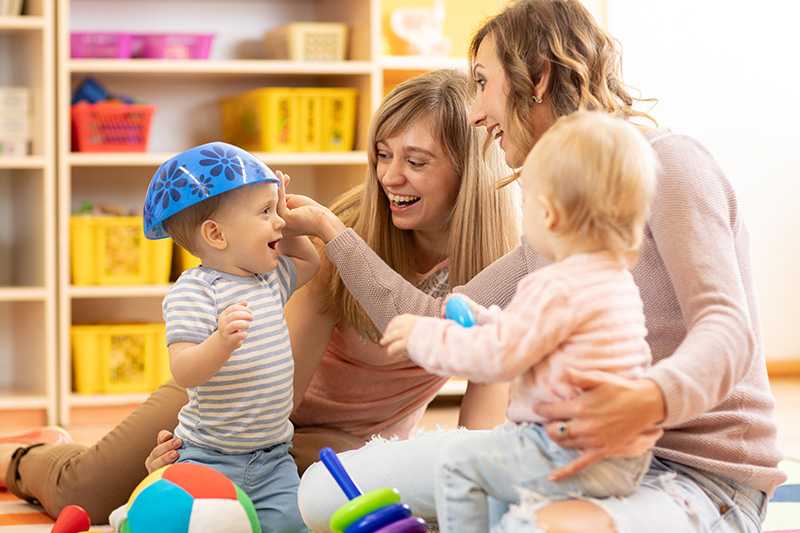 young children playing together with their mothers at play group