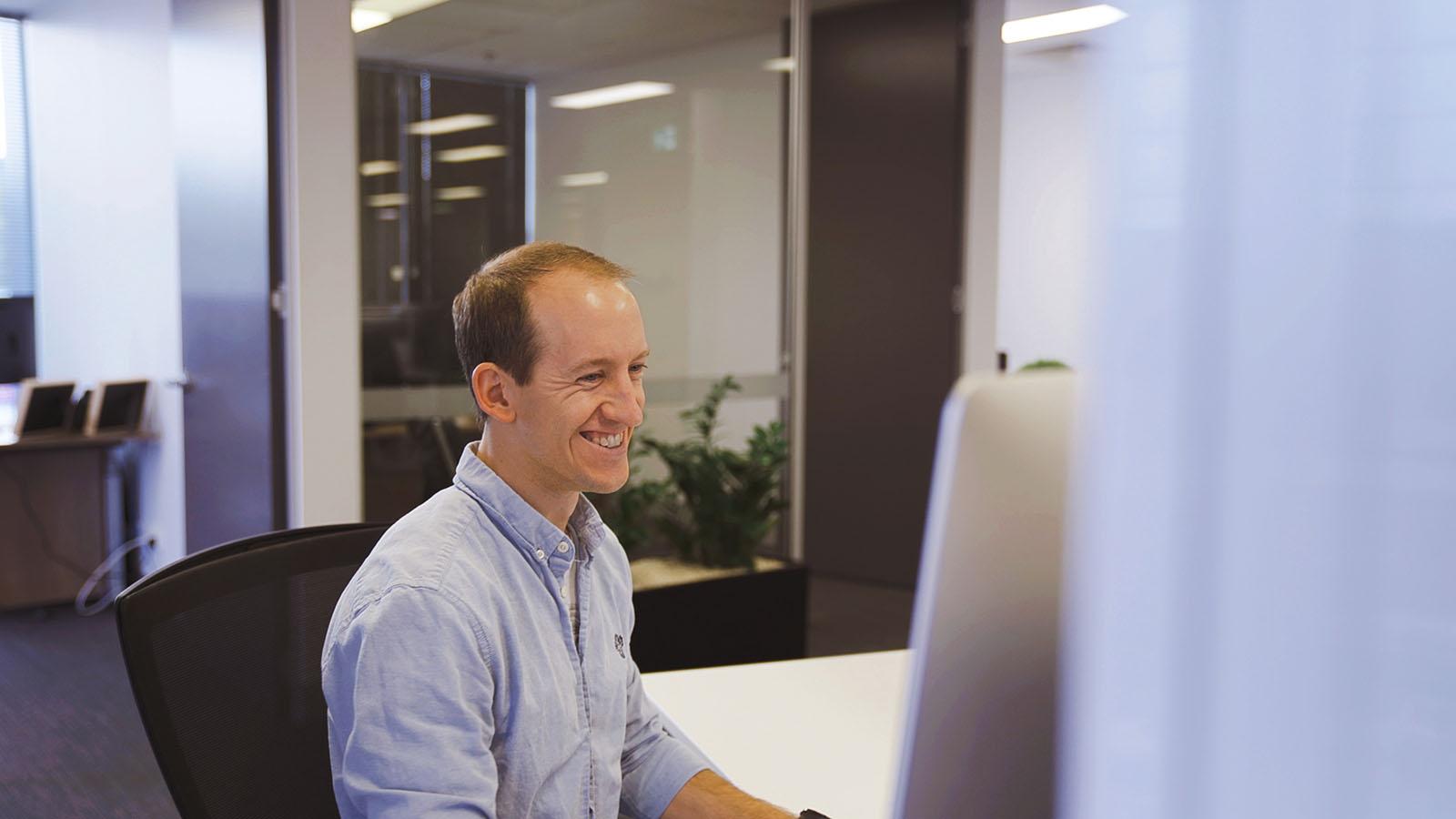 CEM staff designing on desktop computer