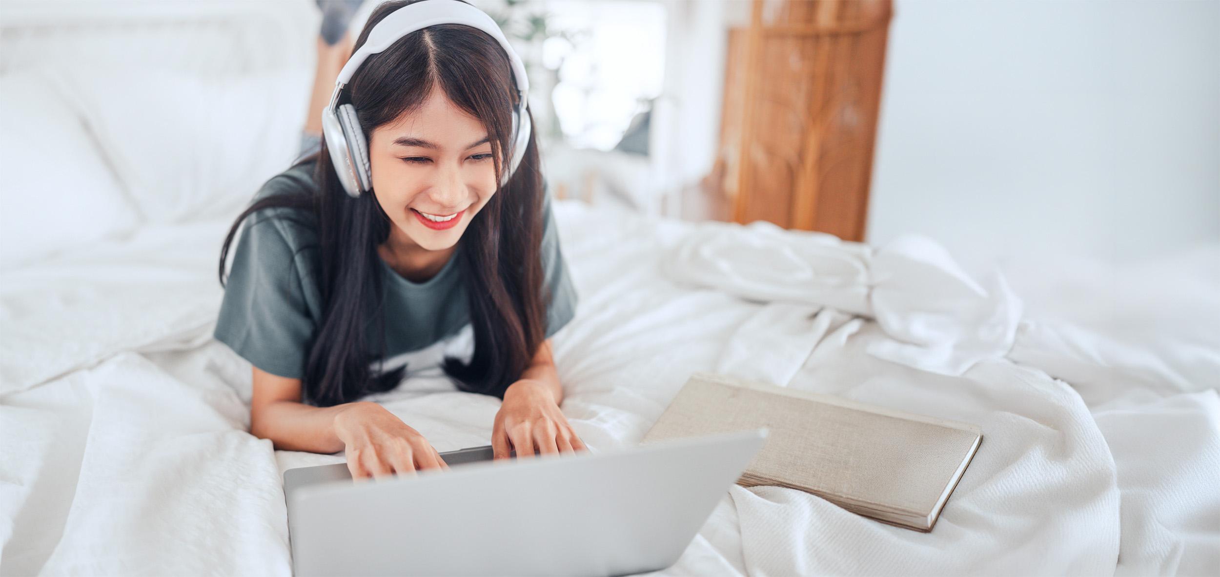 Student using a laptop at home for distance education