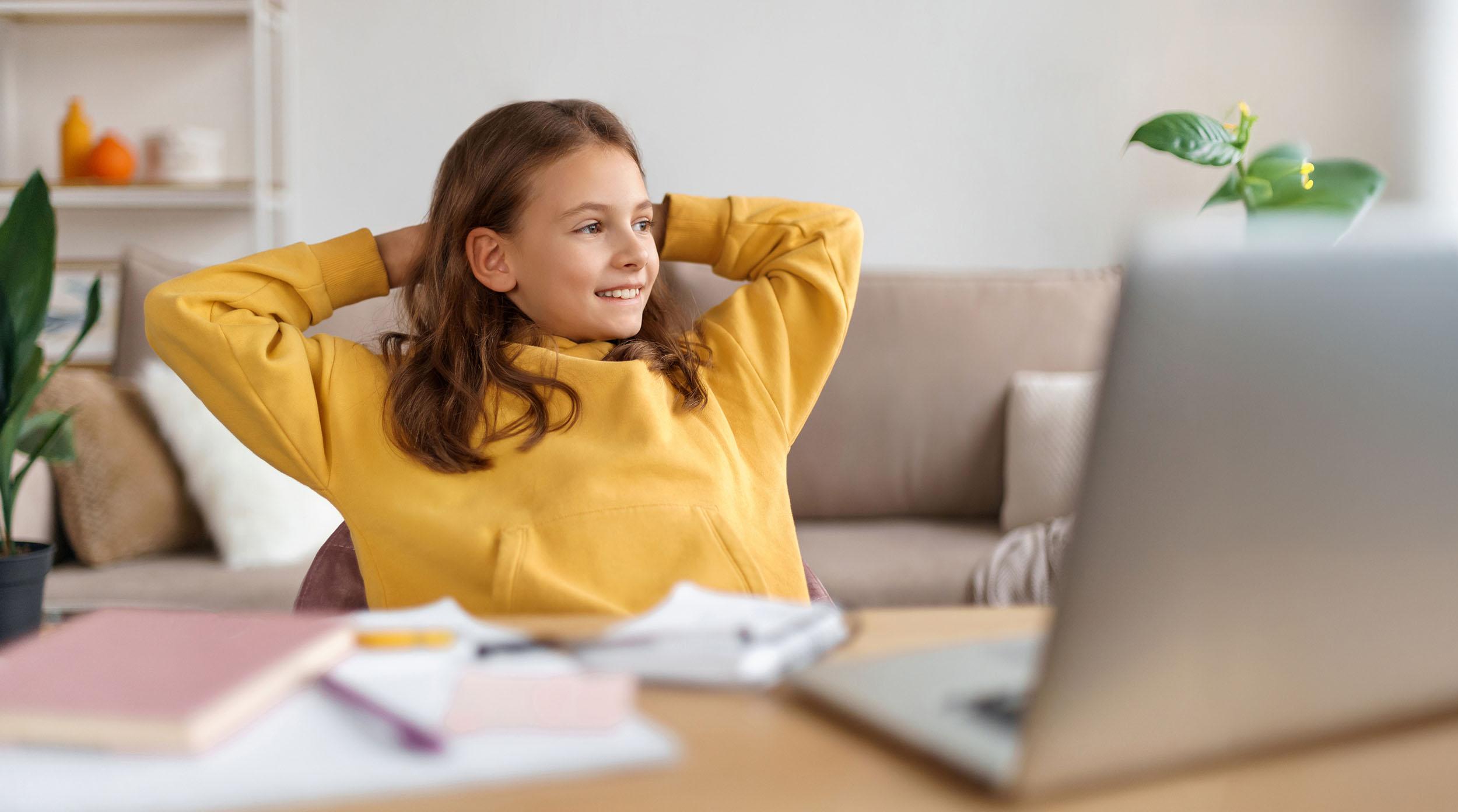 Distance education student studying online with a laptop at home