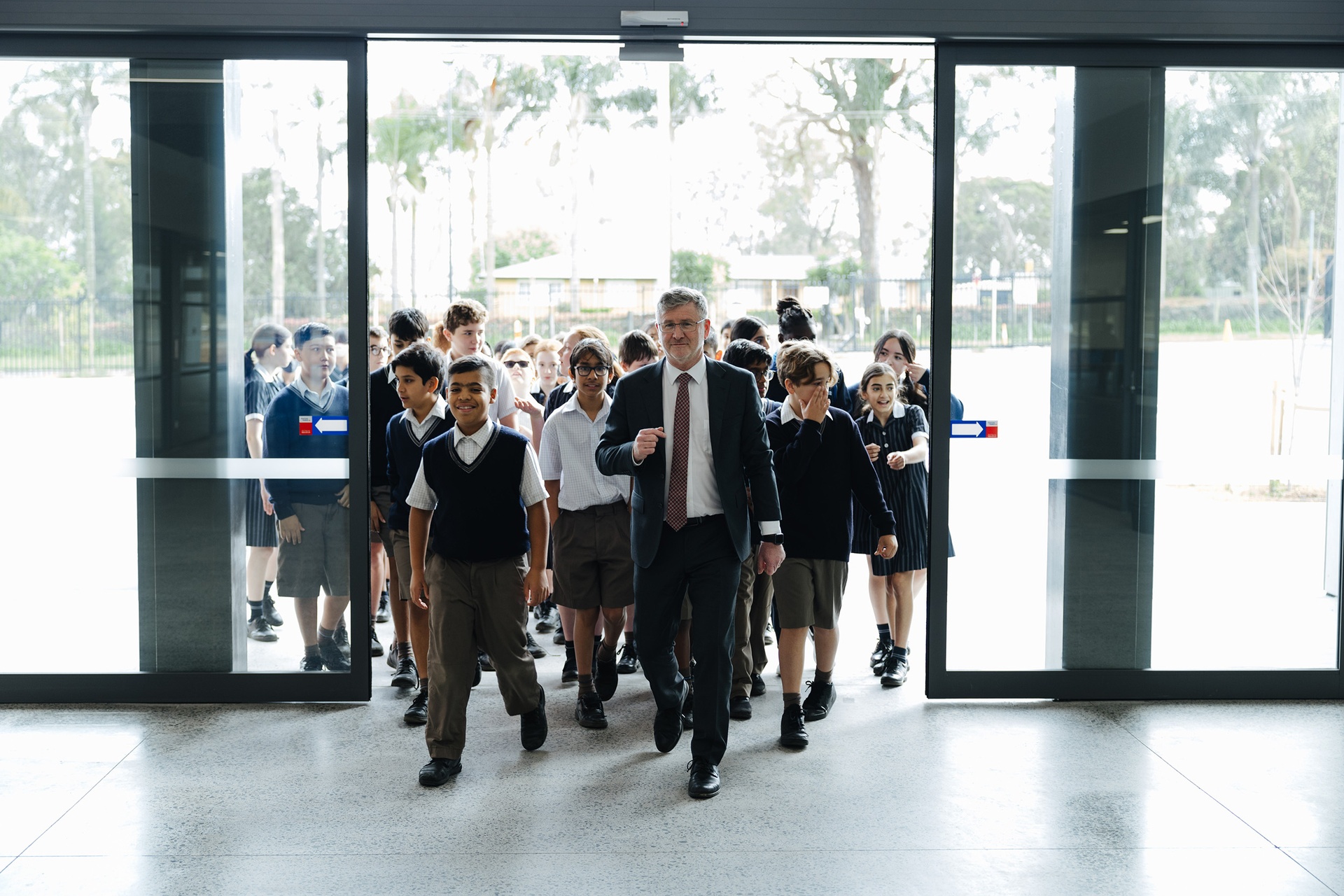 Principal Brendan Corr leading group of Marsden Park students into new building