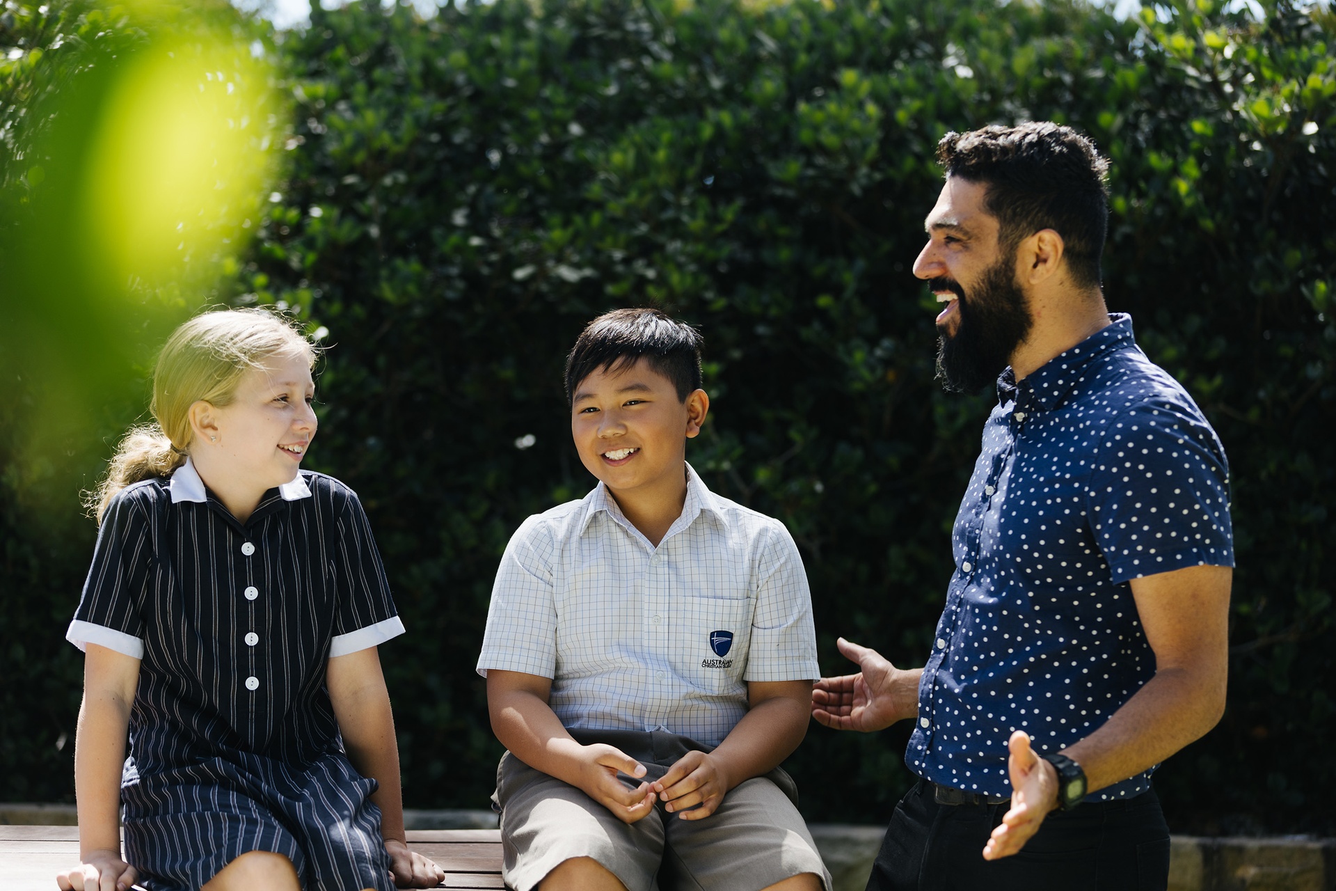 ACC Marsden Park students talking to Primary school teacher