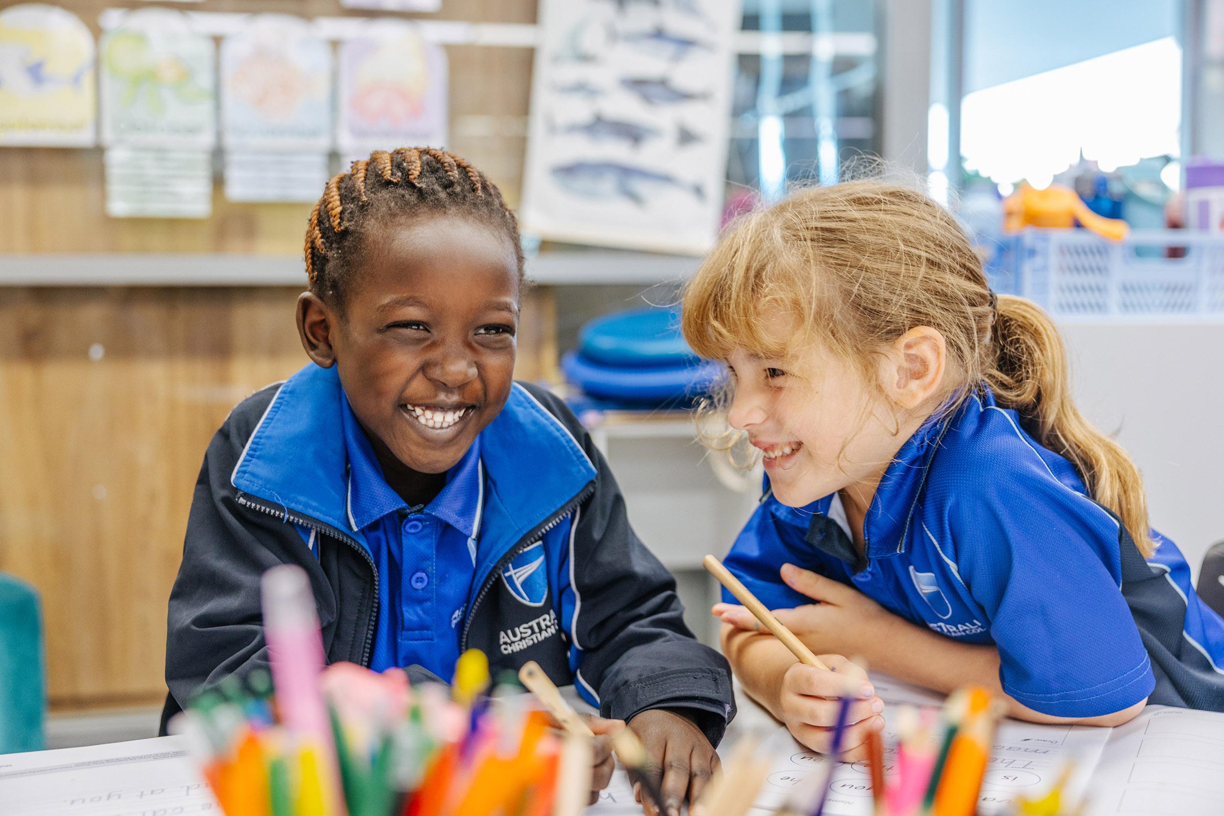Prep students smiling together during a classroom activity at ACC Moreton