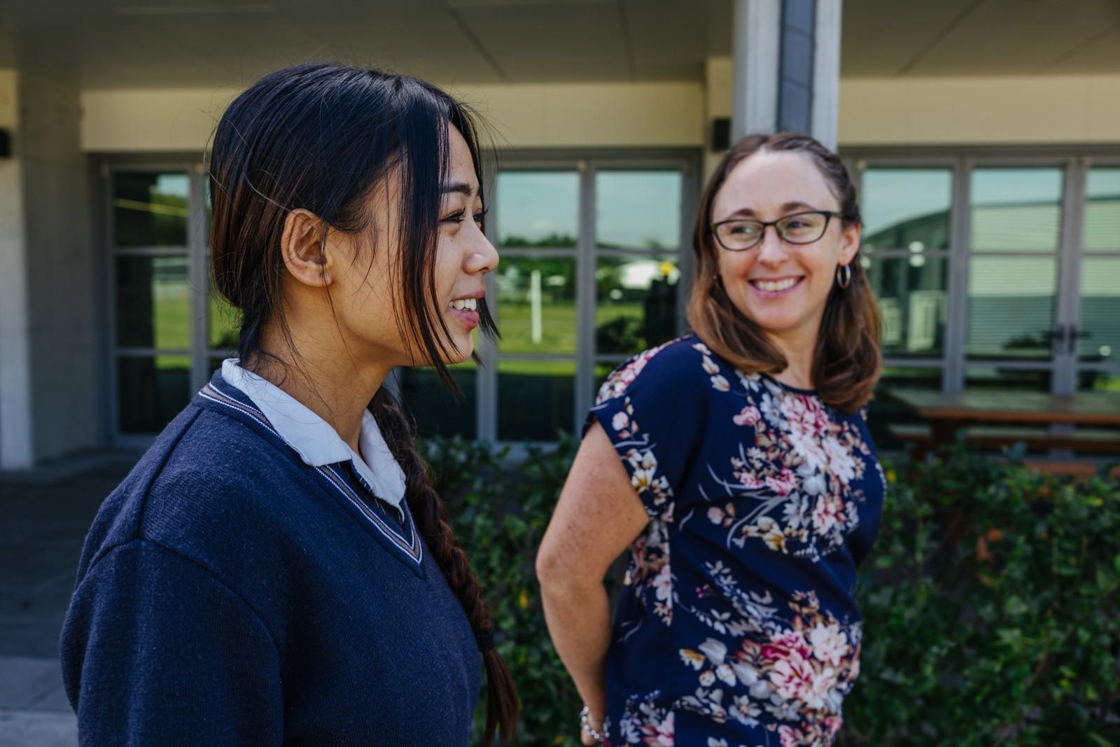Secondary student and teacher walking together during pastoral support at ACC Moreton