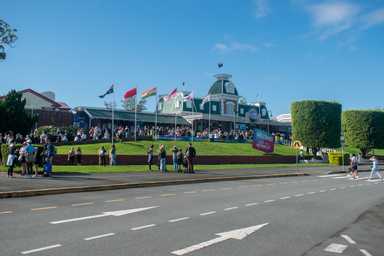 Large group of distance education students on excursion outside Dreamworld 