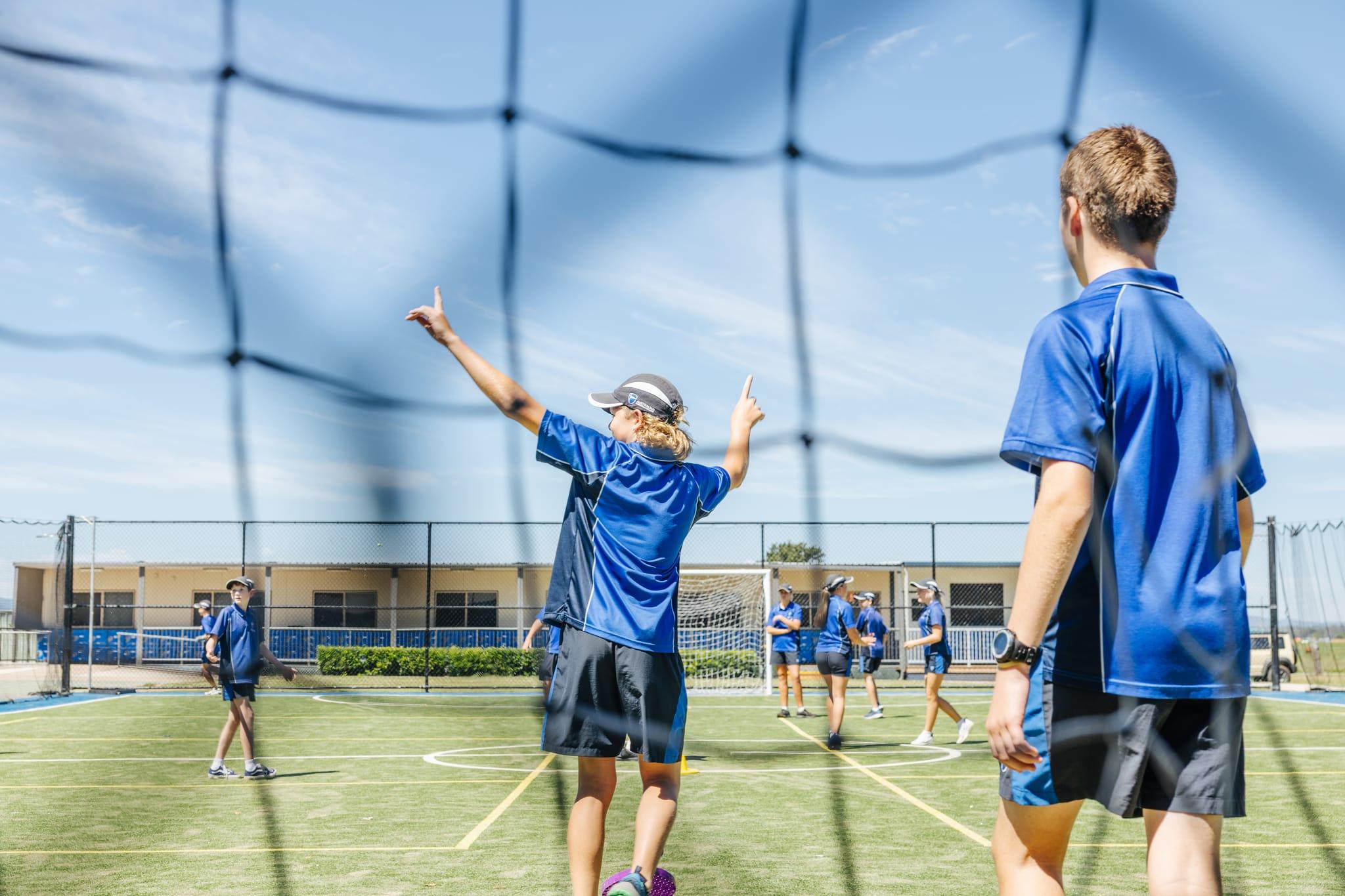 Senior students playing sport at ACC Singleton, expressing teamwork, confidence, and holistic student development.