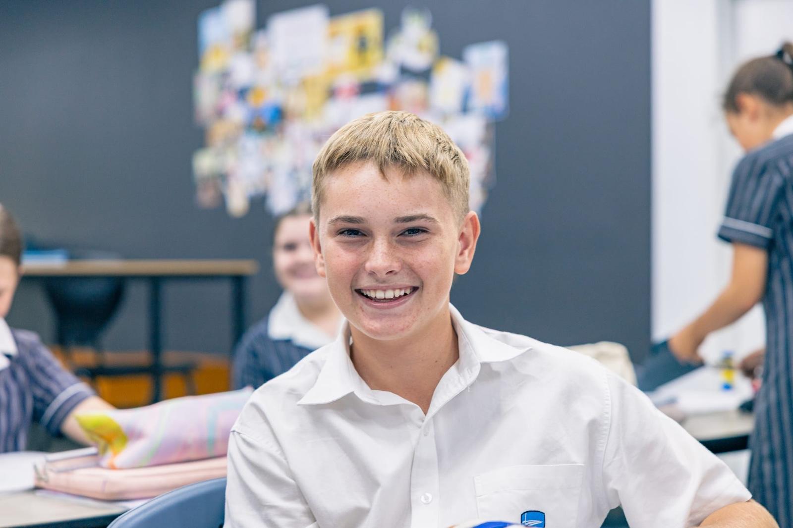 Smiling senior student in classroom at ACC Singleton, reflecting confidence through Christian education.