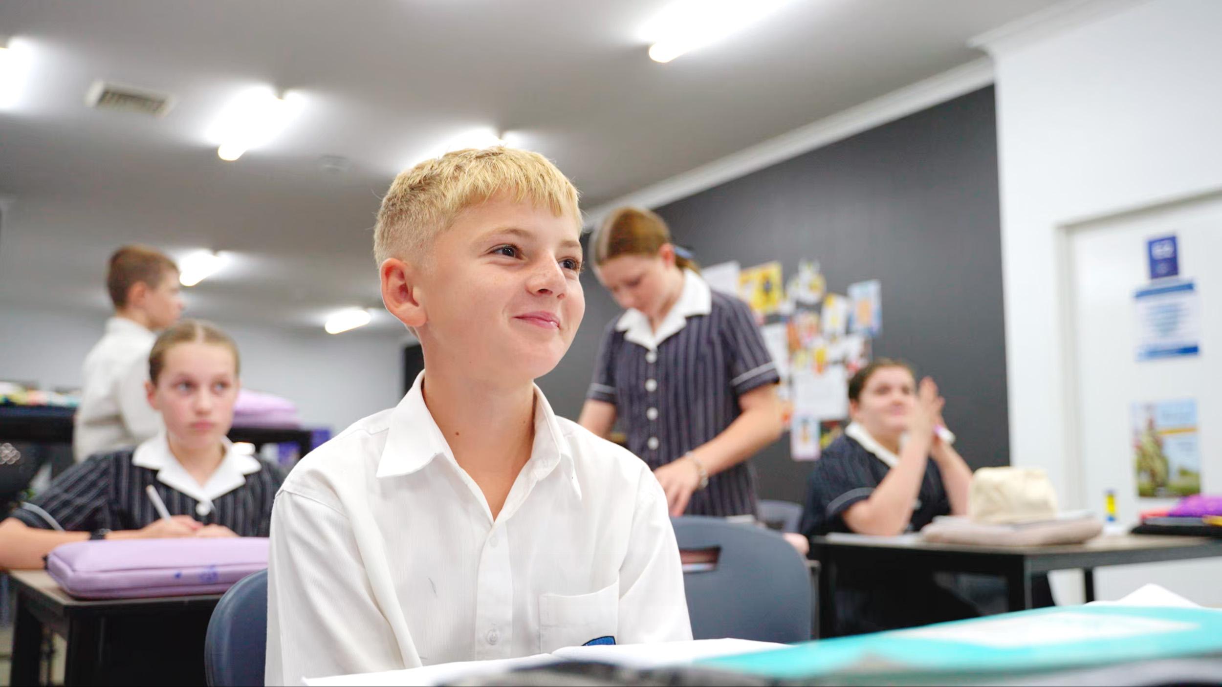 Senior school students at ACC Singleton engaged in learning, enjoying a collaborative classroom environment.