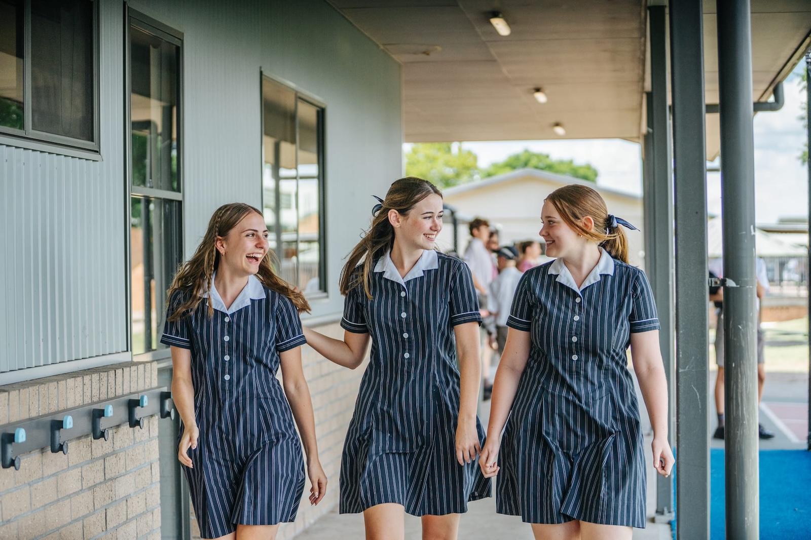 Senior school girls walking together at ACC Singleton, representing friendship and confidence in a supportive school community