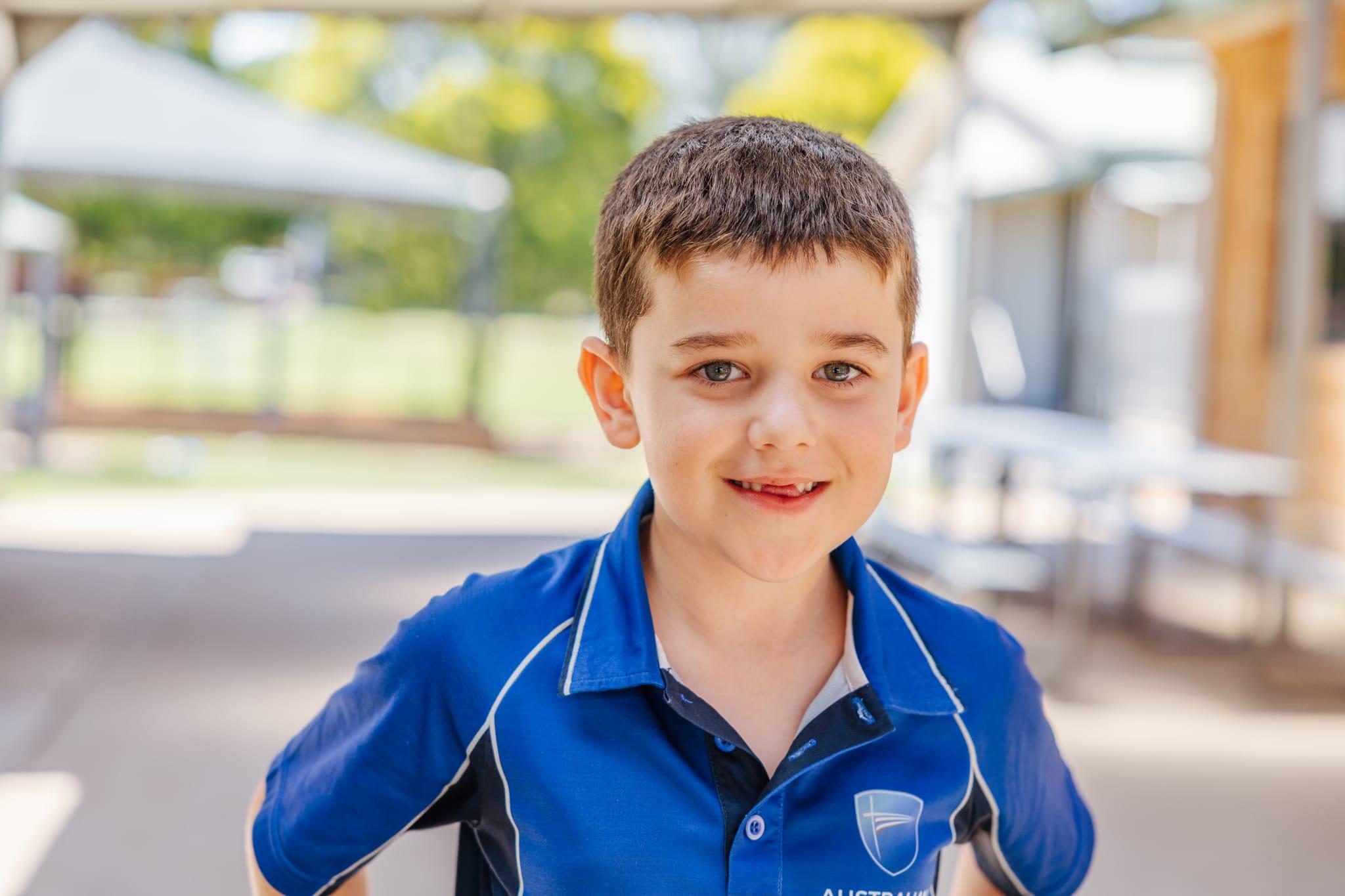 Smiling junior student at ACC Singleton, representing personalised care and a nurturing learning environment.