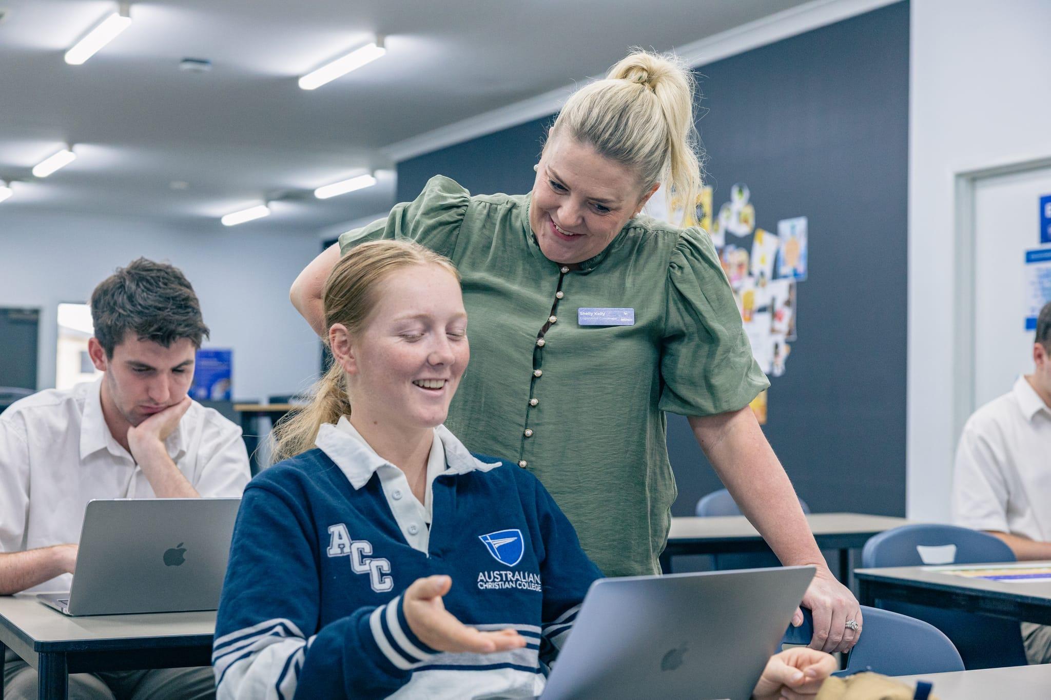 Senior student receiving personalised guidance from a teacher during study time, highlighting targeted HSC preparation and pastoral care.