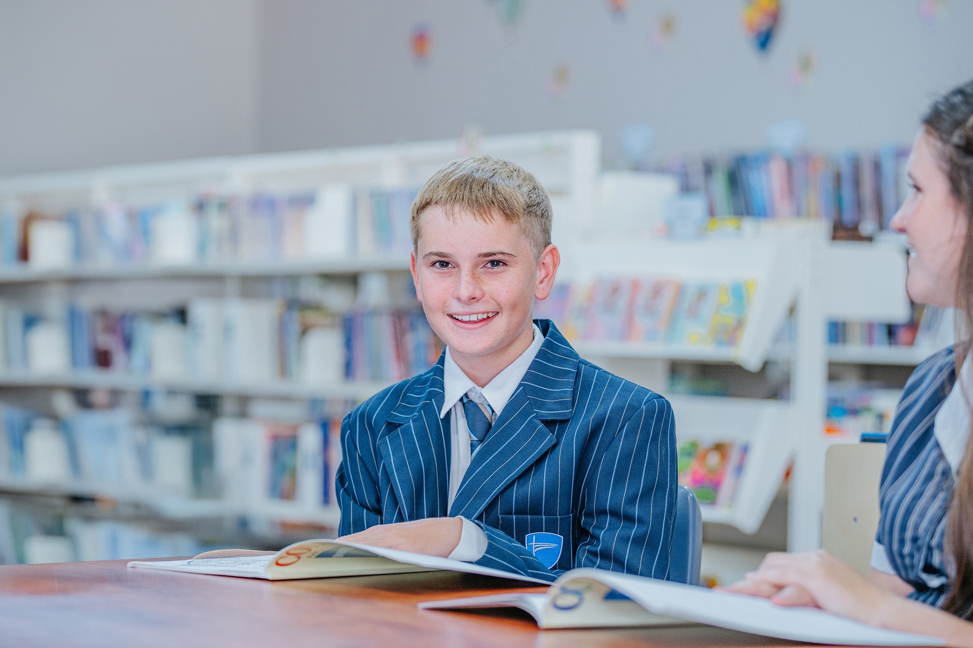 Smiling Singleton year 7 student wearing ACC Singleton school uniform blazer
