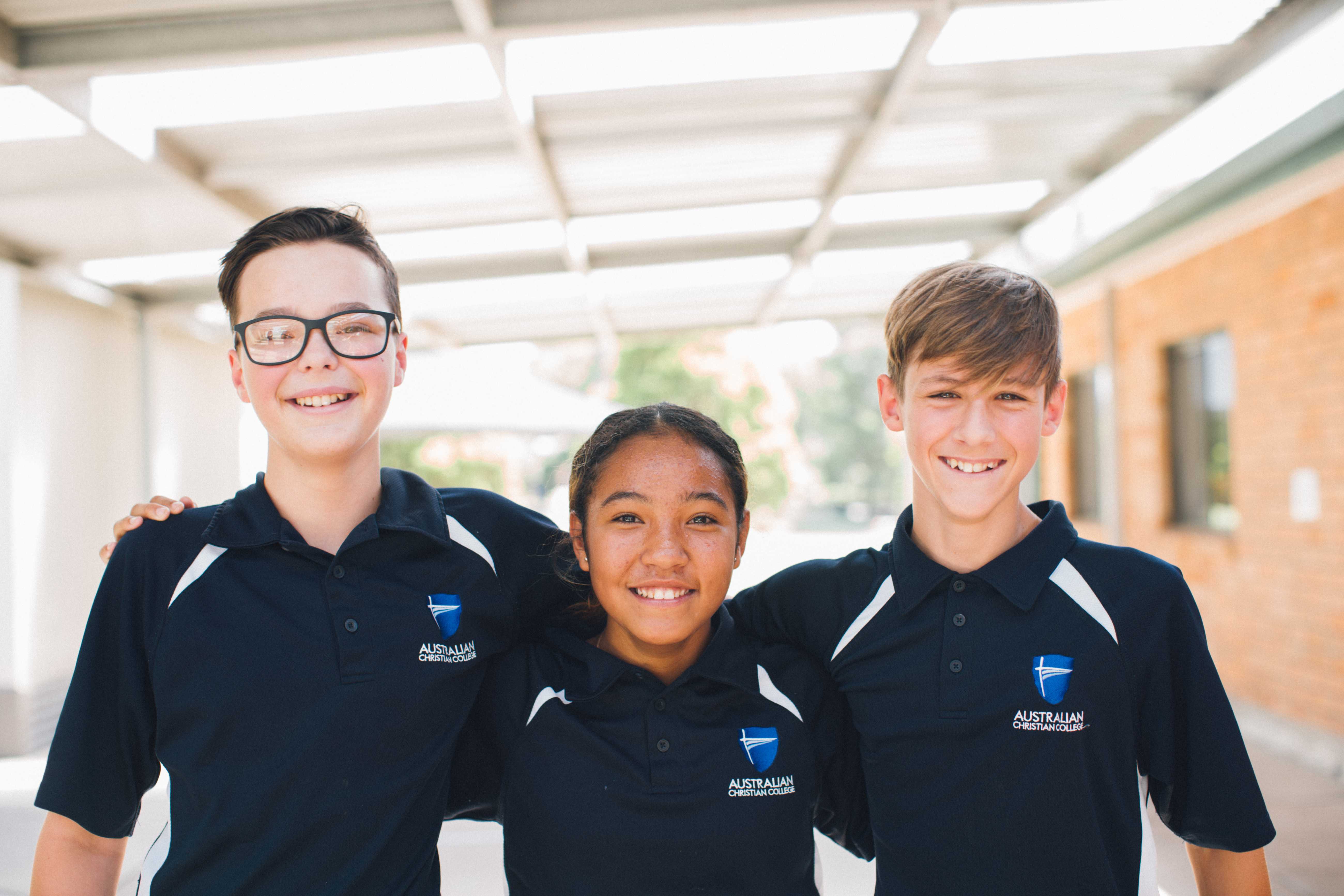 ACC Singleton year 7 students smiling and wearing sport uniform