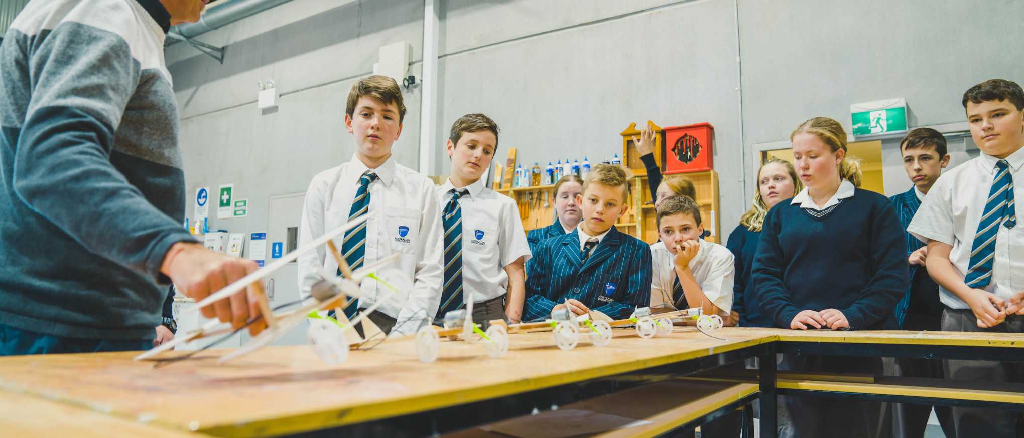 ACC Singleton design and technology teacher explaining propeller powered device to secondary students