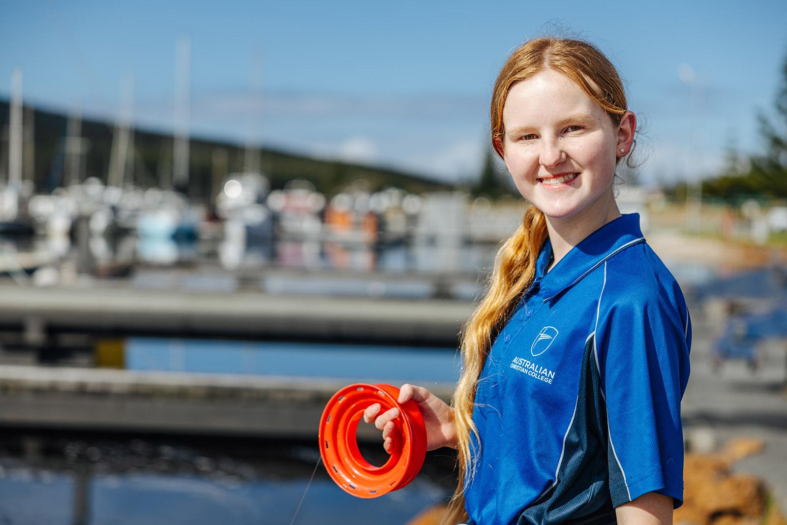 Albany primary student fishing at the harbour during a school co-curricular program