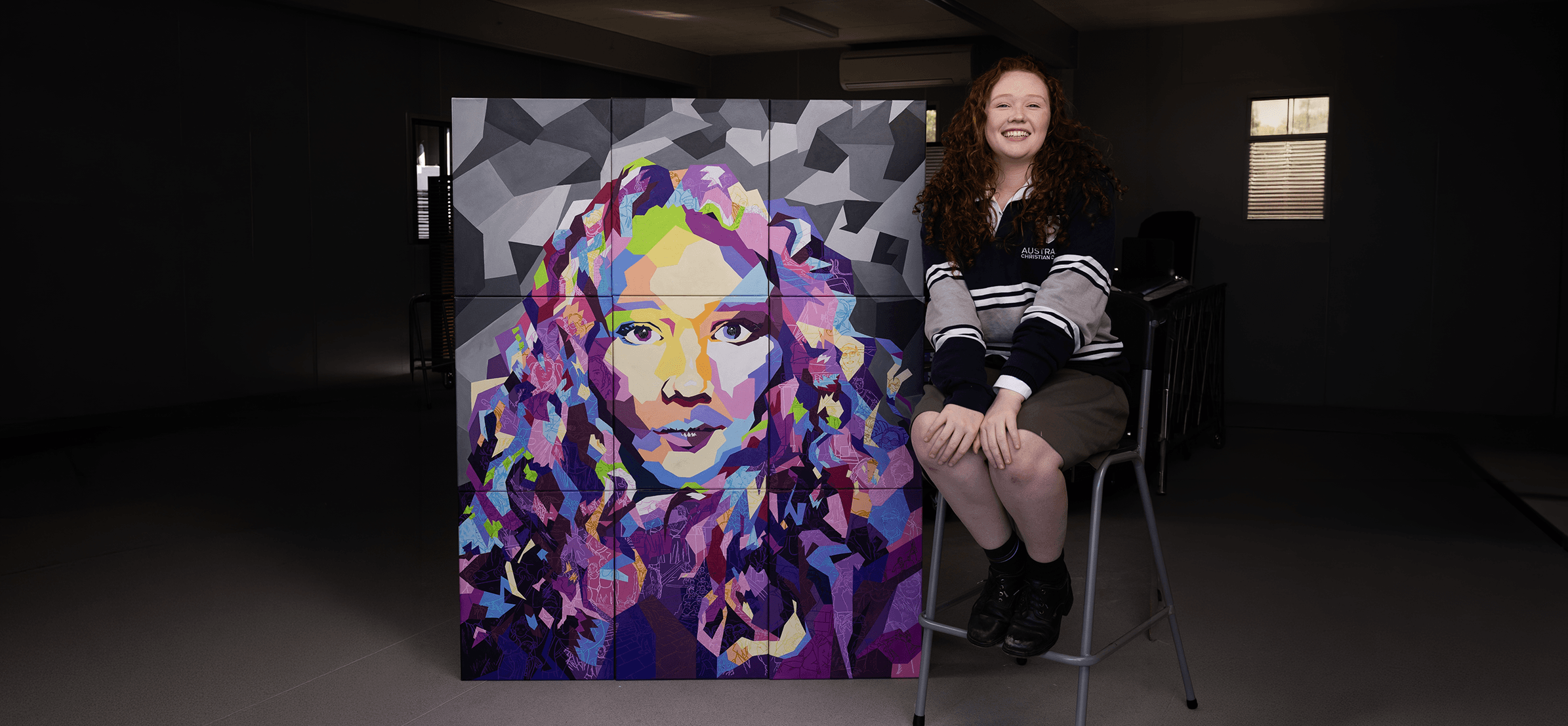 Student painting at an easel during a creative activity