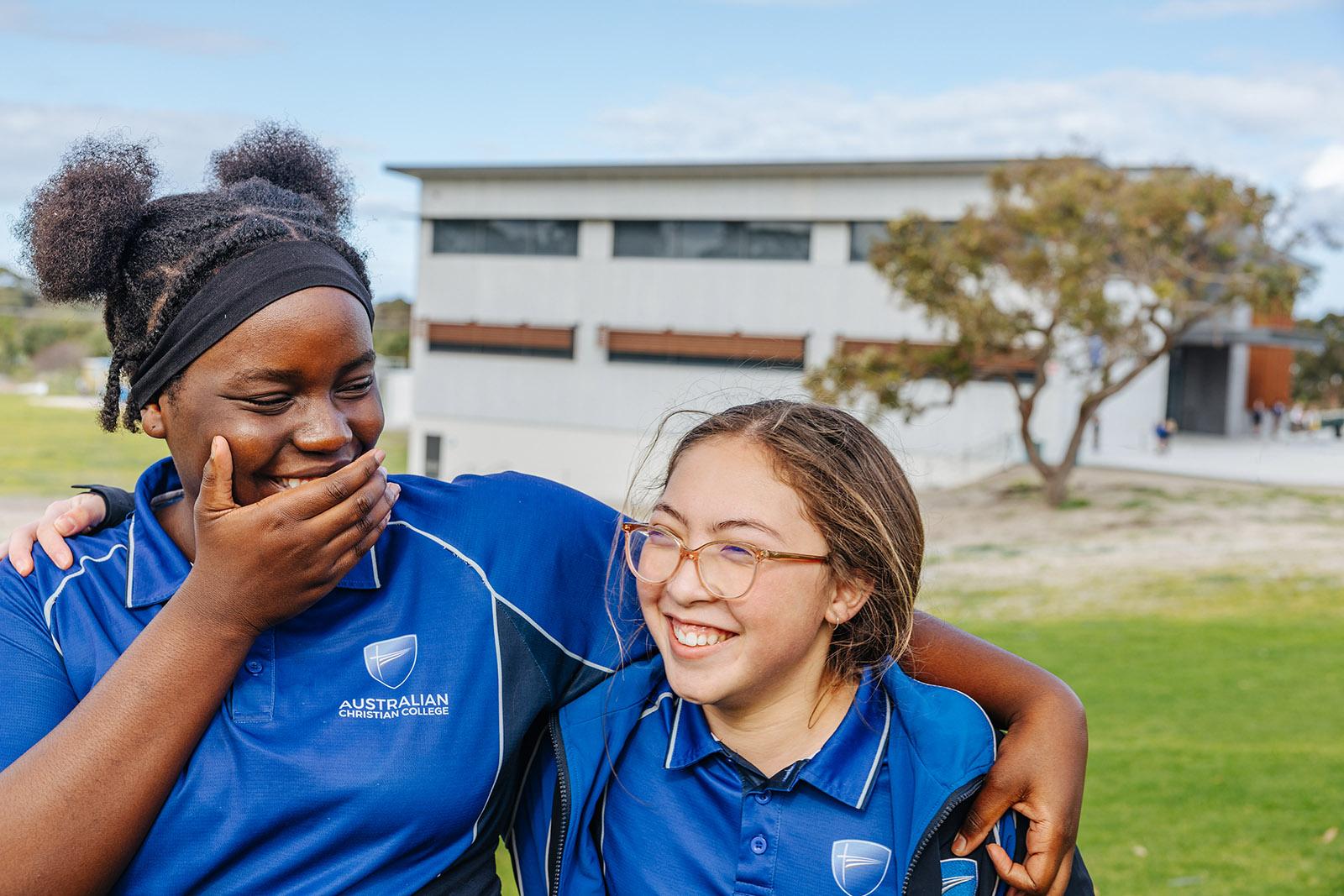 ACC Southlands students in sports uniform laughing on school oval
