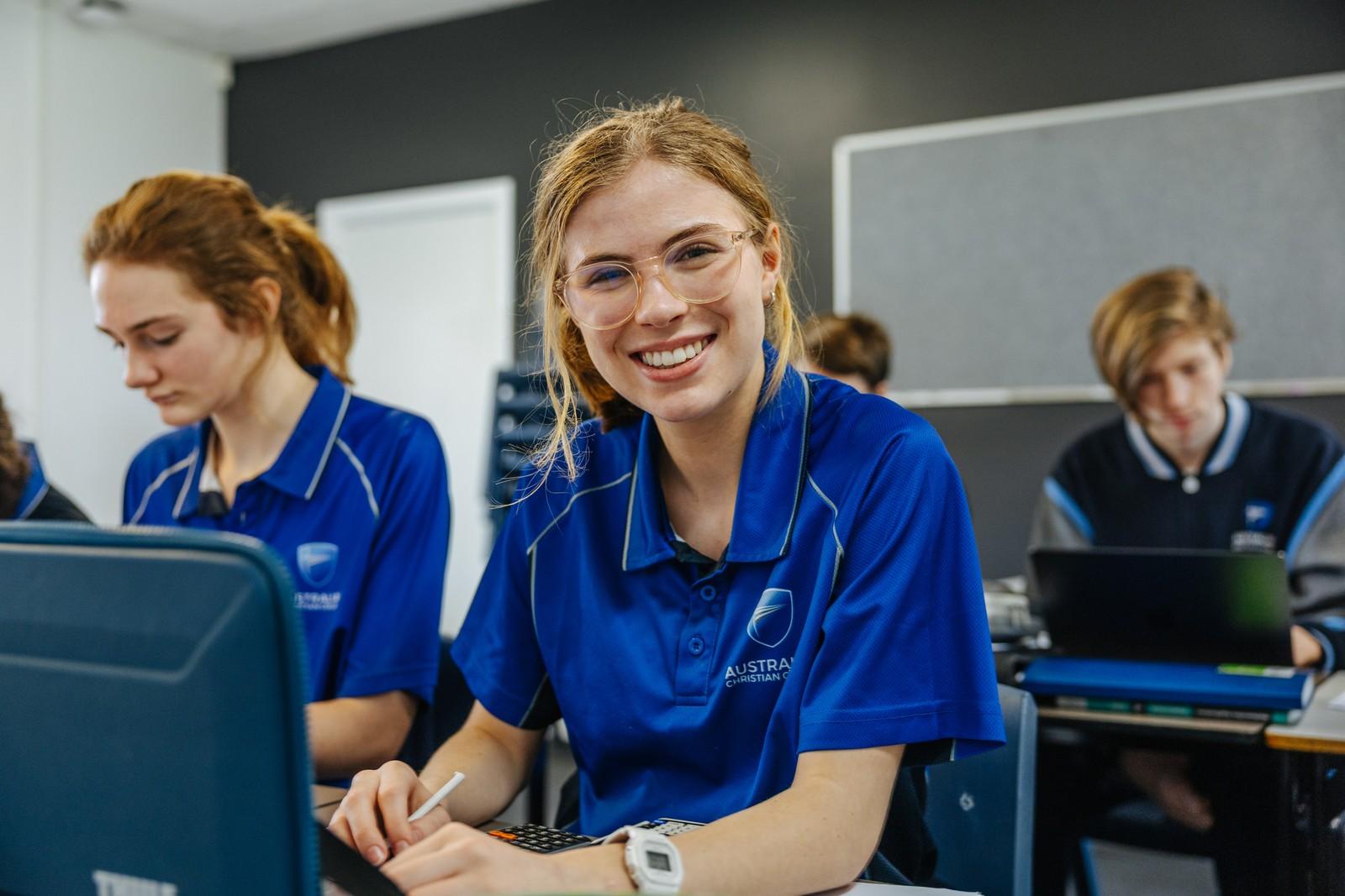 Smiling secondary girl engaged in learning in an ACC Southlands classroom