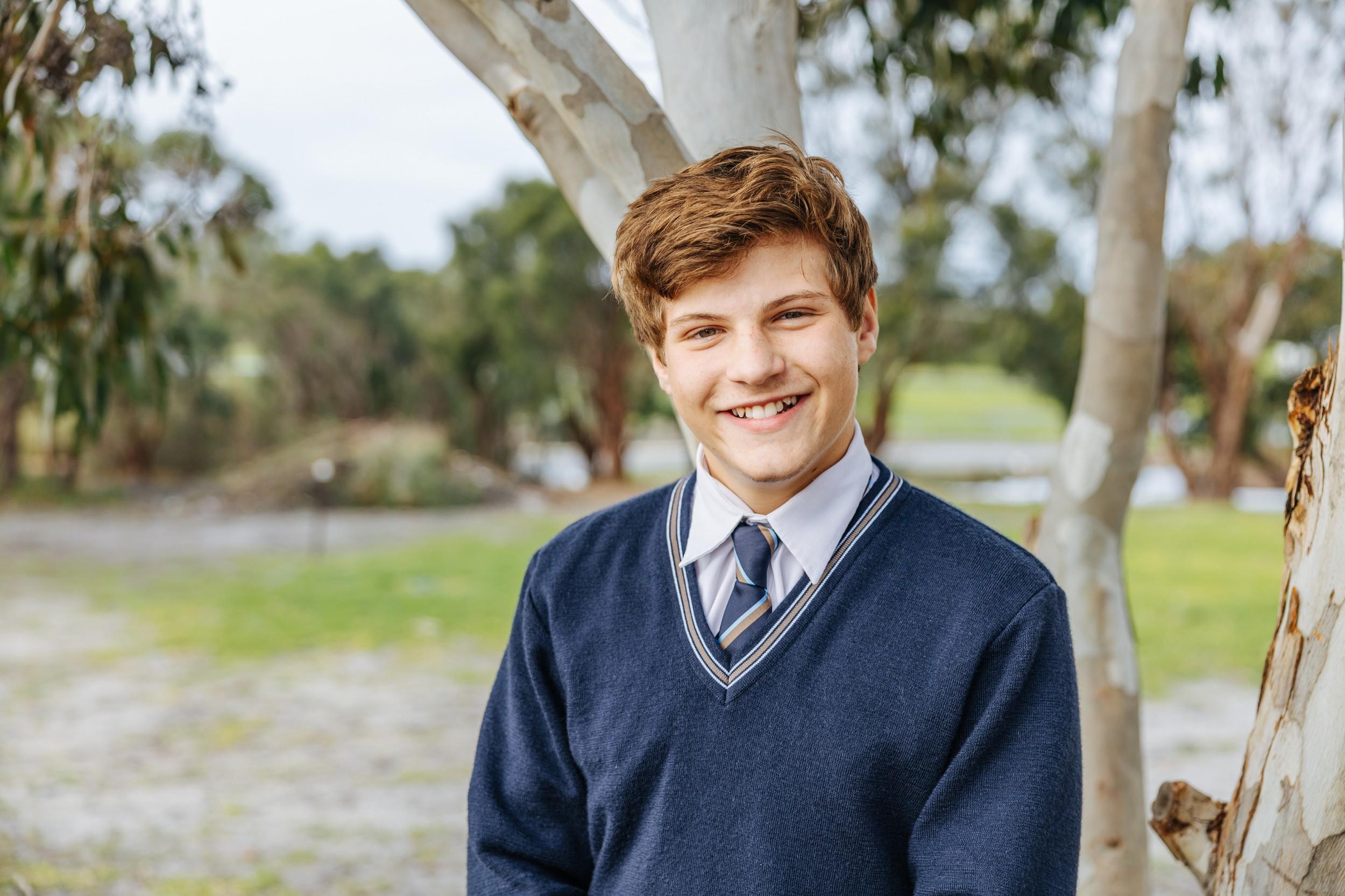 Smiling ACC Southlands secondary student in school uniform outdoors