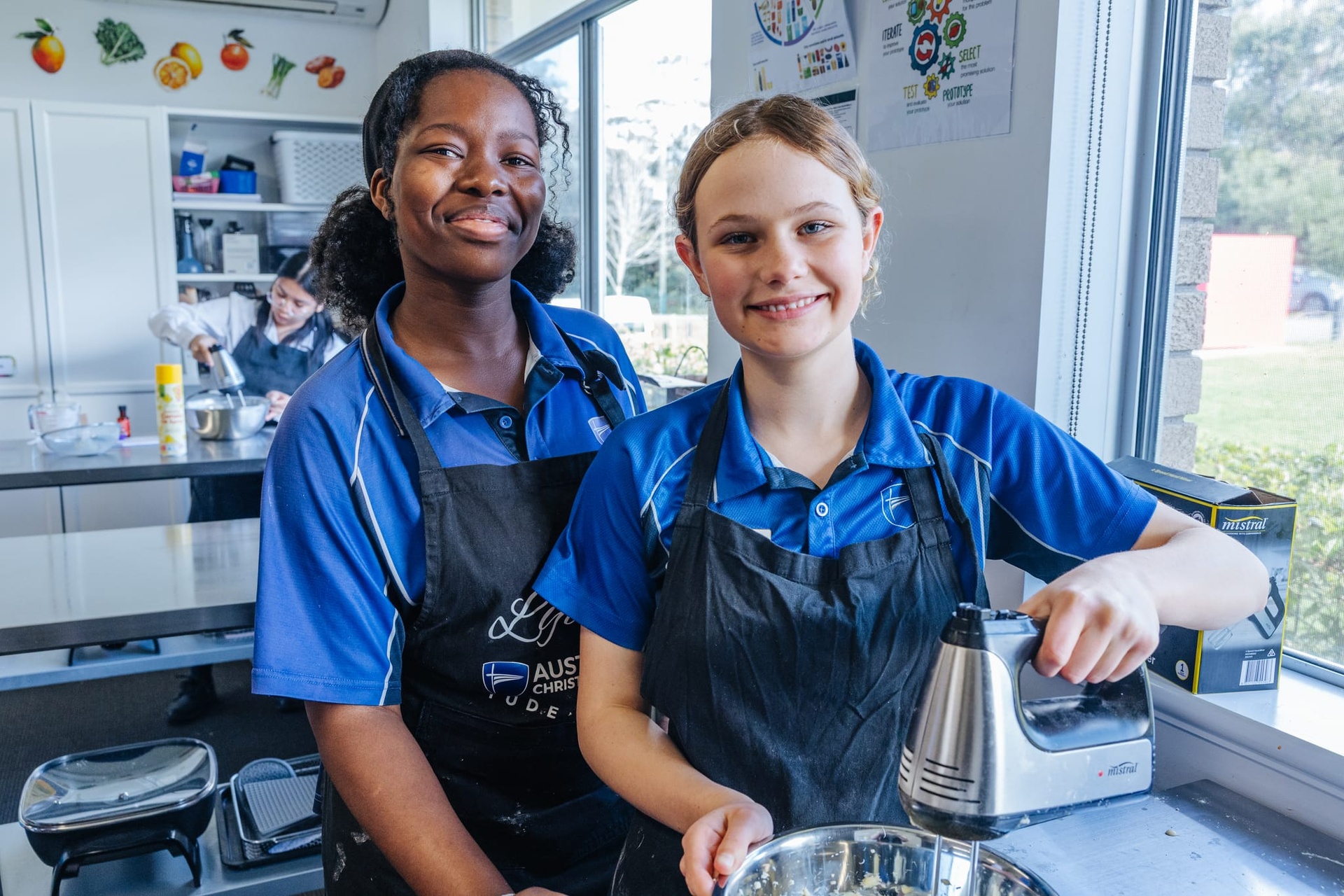 ACC Southlands high school students in aprons during cooking class
