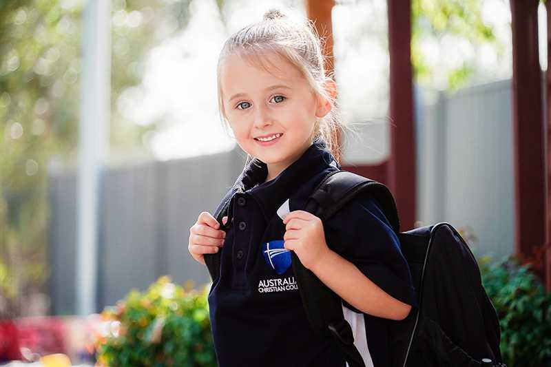 Kindergarten student with backpack ready for school