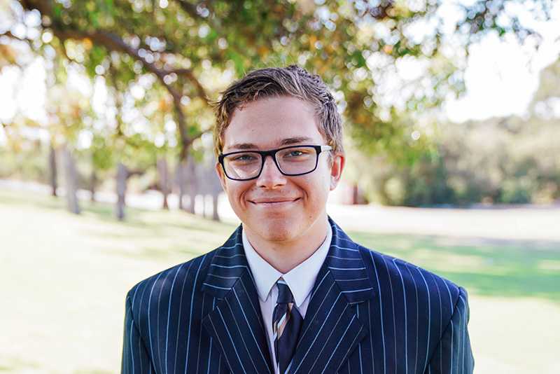 Secondary student wearing ACC Southlands blazer and glasses